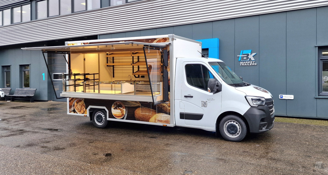 Zijaanzicht van een verkoopwagen voor brood met geopende luifel