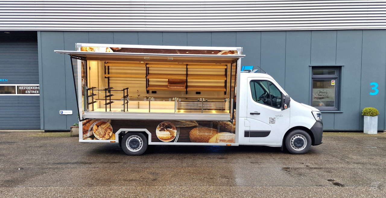 Zijaanzicht van een verkoopwagen voor brood met geopende luifel